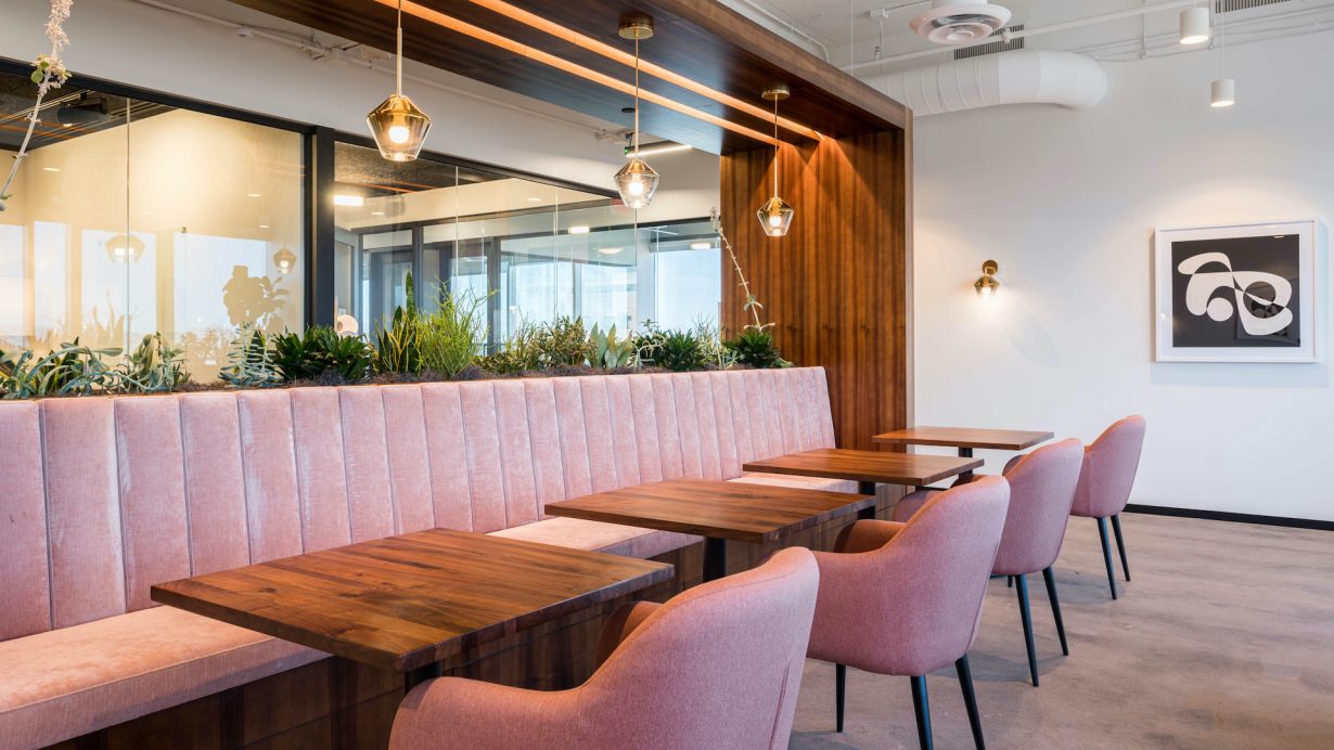 A striking pink banquette makes for a comfortable and stylish lunch spot.