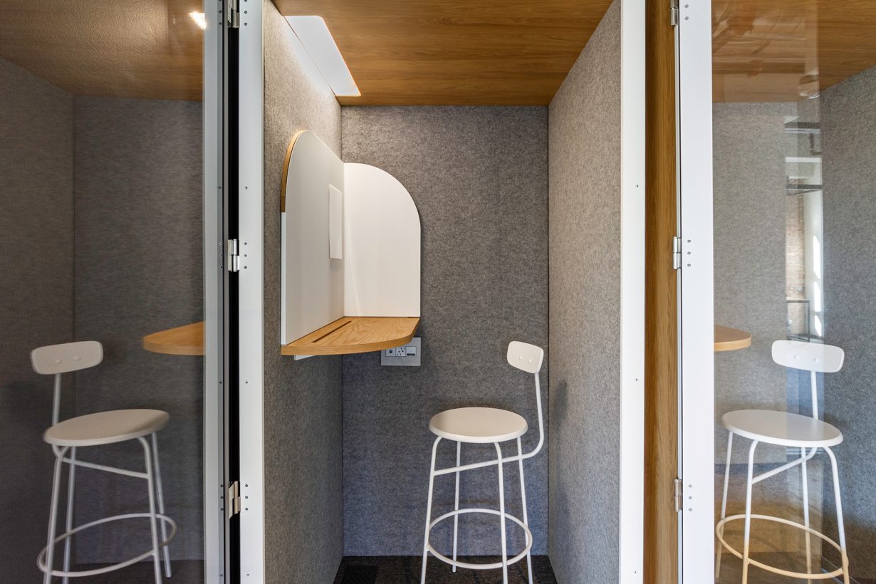 Soundproof phone booths provide members with a space for private calls or heads-down work.