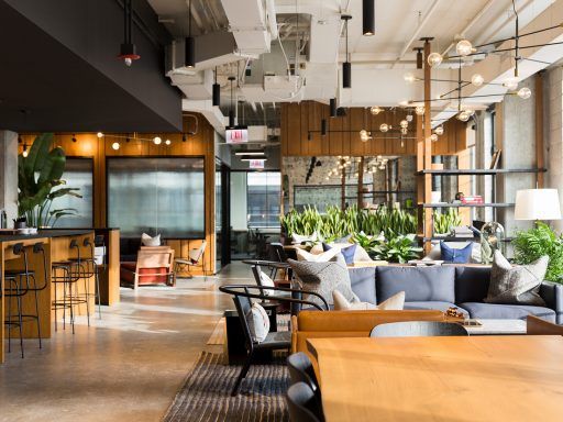 Sleek wood furnishings and plenty of greenery create an inviting atmosphere in Chicago’s Industrious Fulton Market.