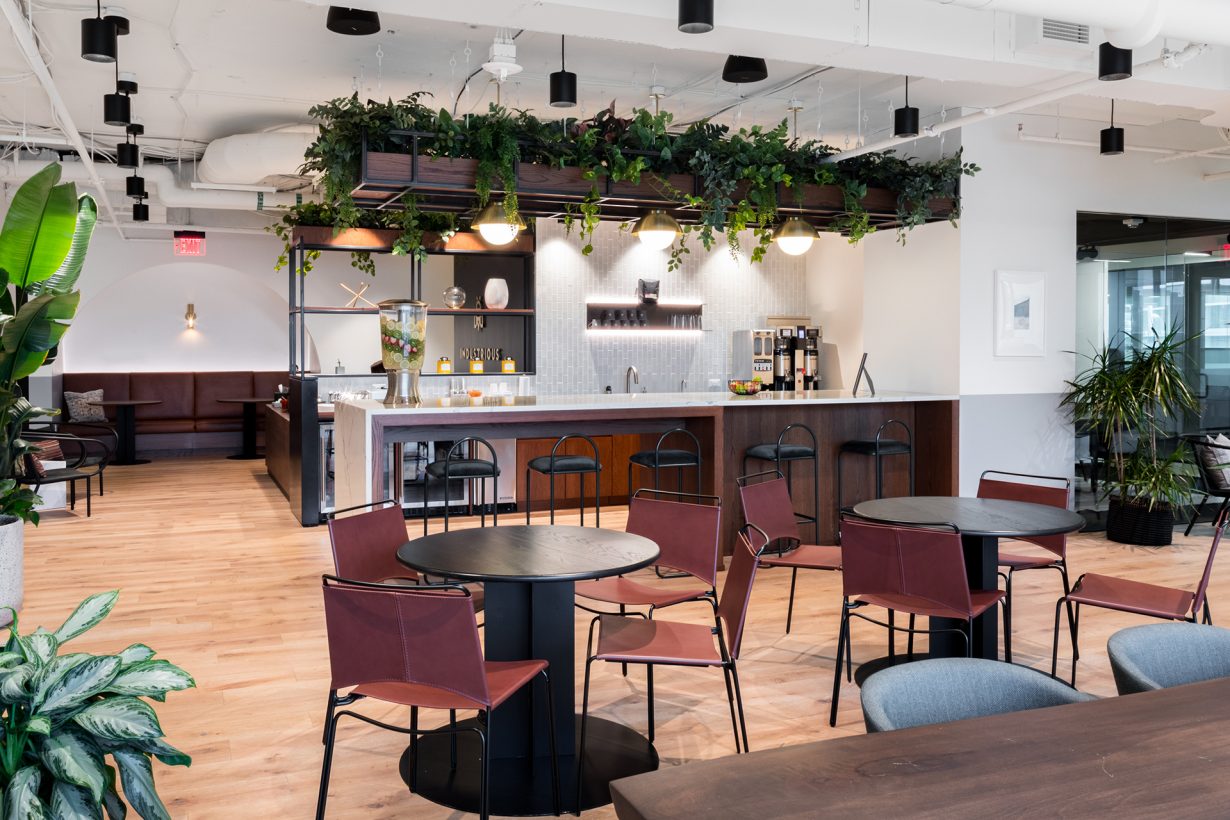 Greenery fills the cafe and kitchen at Industrious Carlyle Tower.
